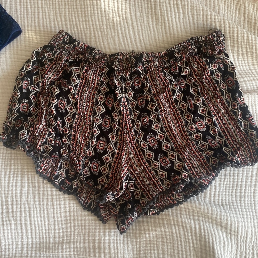 red and black patterned flowy shorts